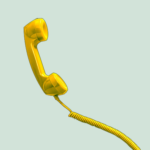 No-Hanging-Up Feature - A yellow old style phone handset and cord