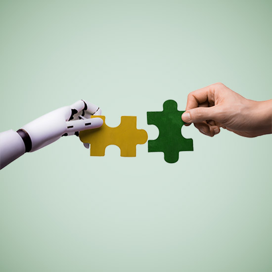 Robot arm holding a puzzle piece up and a man holding another piece trying to align the pieces.